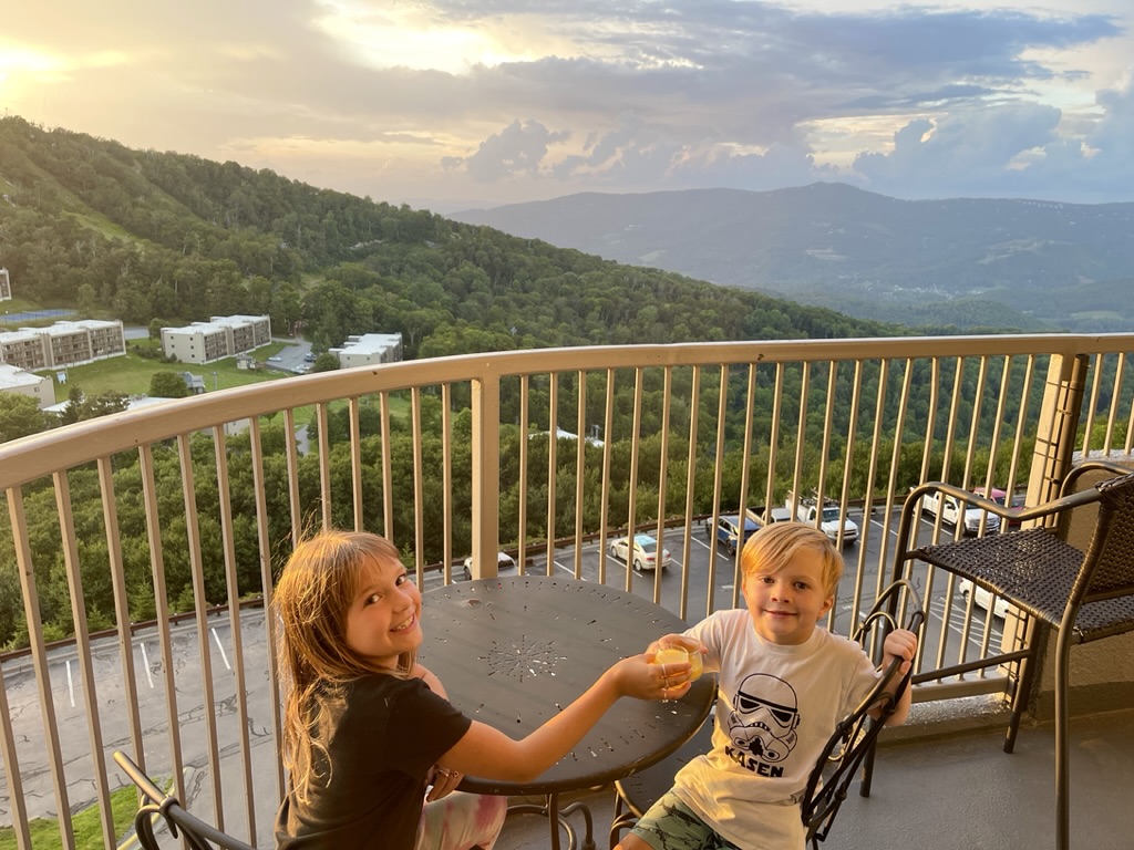 Children enjoying the sunset view from the Sugartop balcony